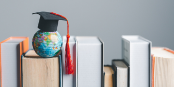 Graphic featuring books, globe, and graduation cap
